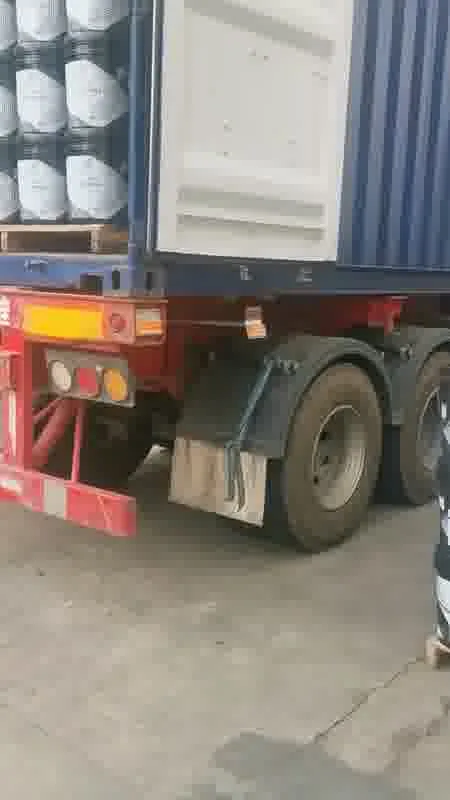 Pails moving onto the truck at the loading dock
