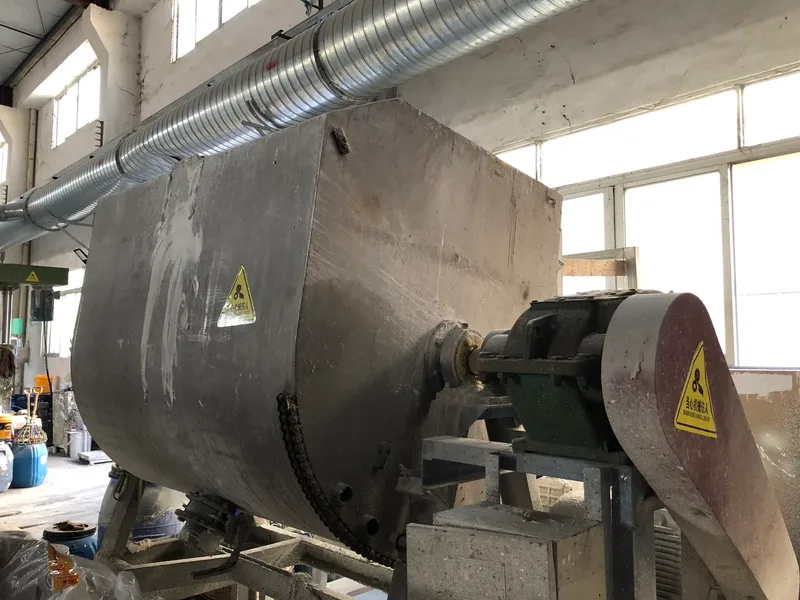 Kneader close-up: sigma-blade shaft inside the trough
