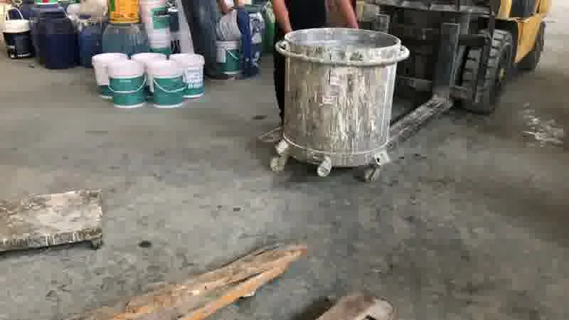 Batch mixing — pigment being folded into the base