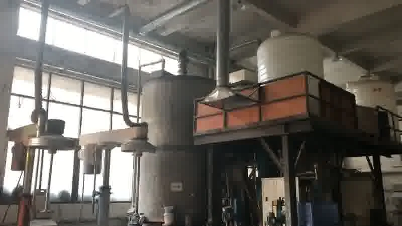 Overhead piping, tanks and the mezzanine feed platform