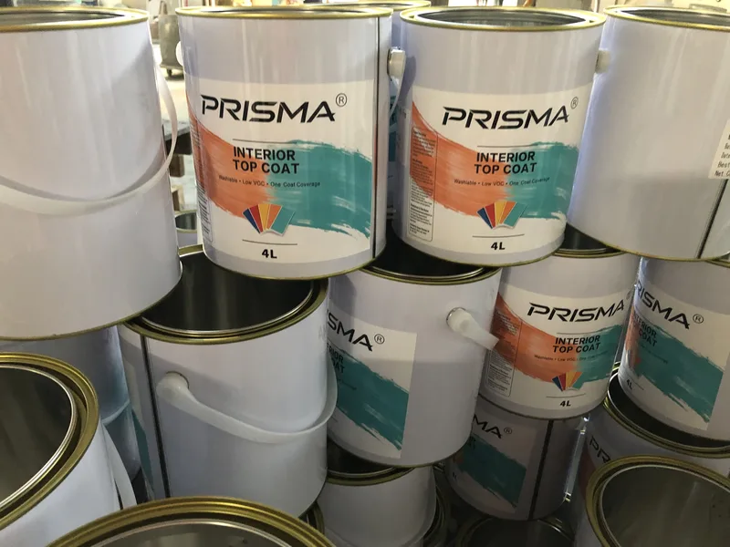 Filled and lidded pails on the line-side conveyor