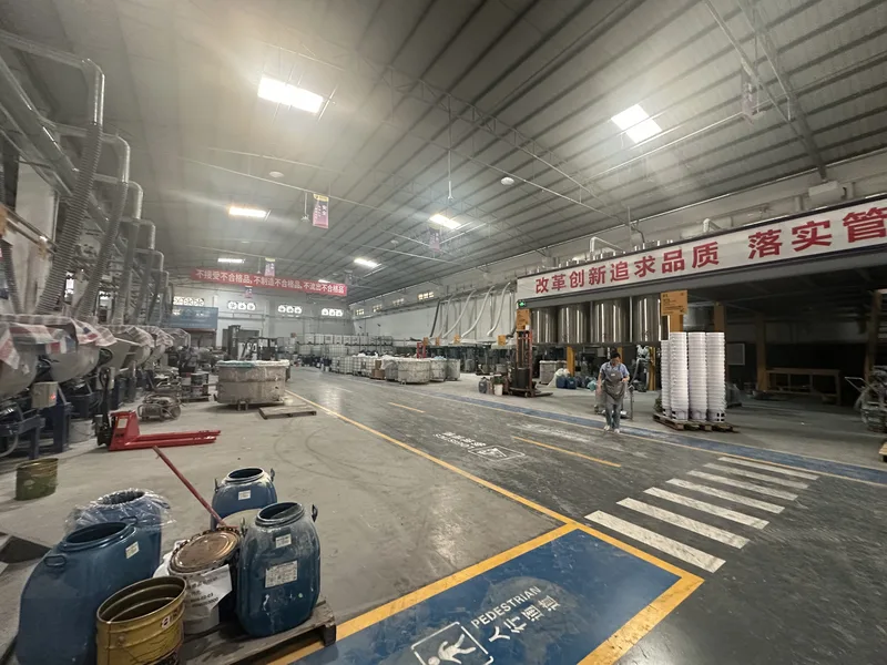 Finished-goods yard with IBC totes and forklift
