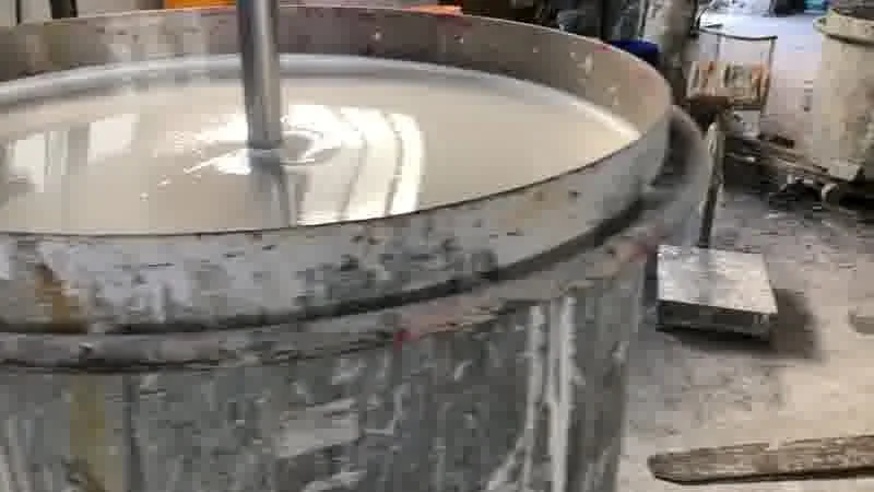 Raw-material aisle — bagged stock organised by grade